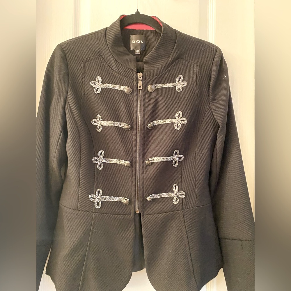 Black XOXO jacket with silver details.